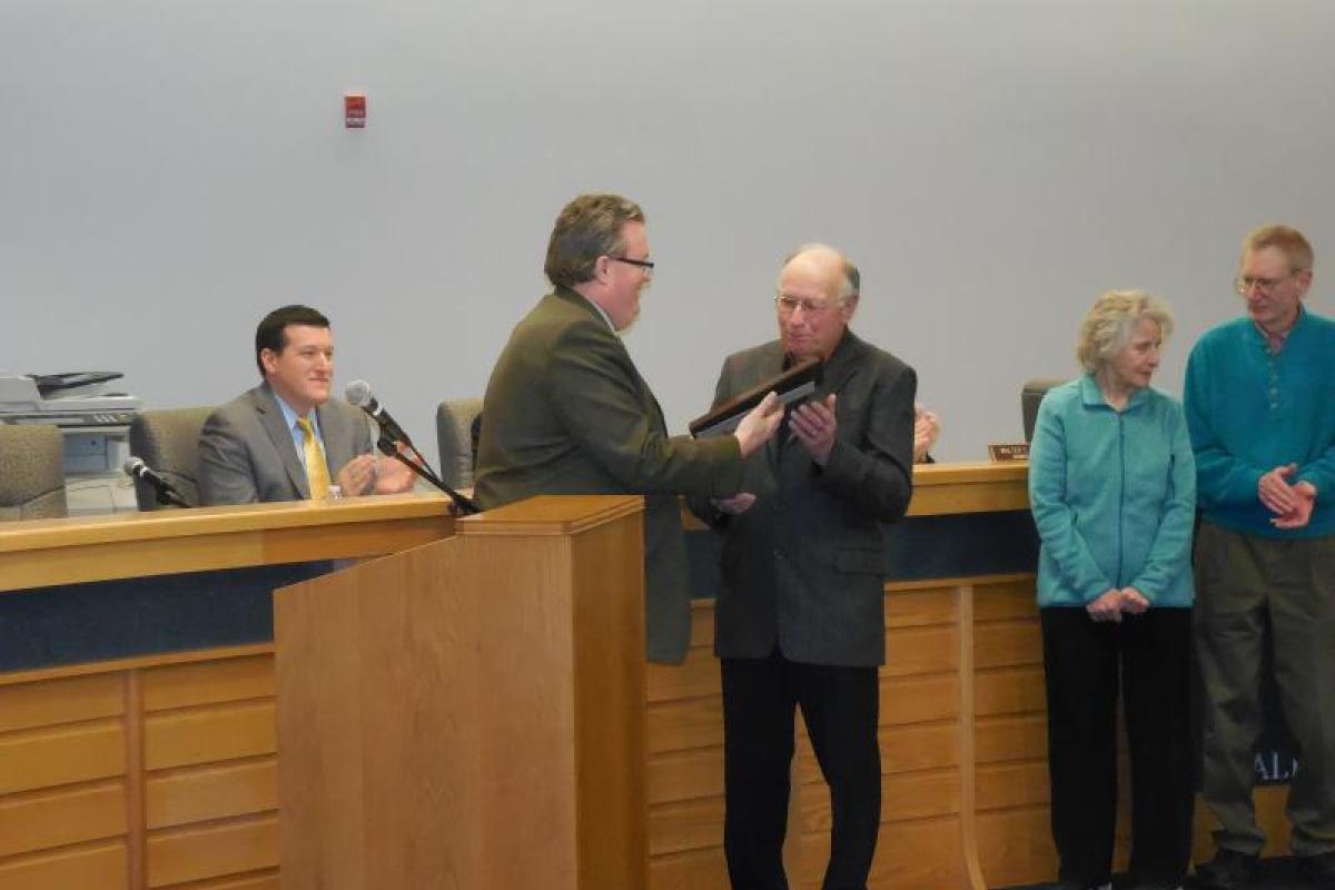 Supervisor Kevin Tollisen presented the charter to President James Bold
