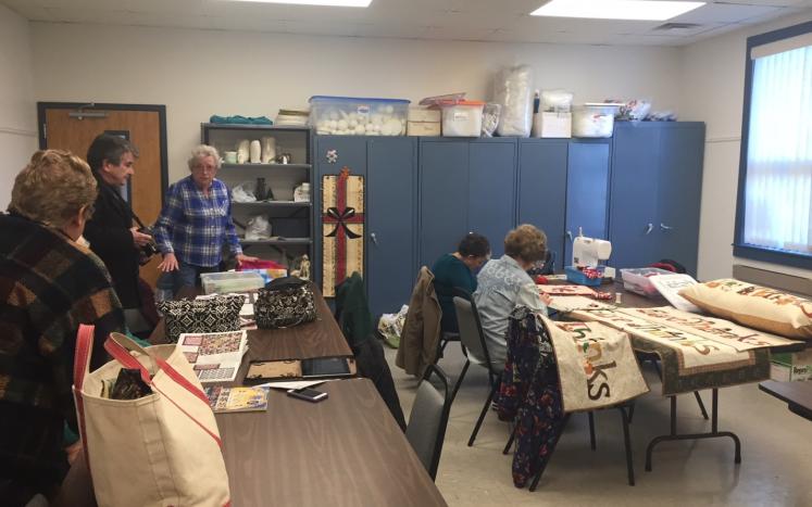 seniors making quilts